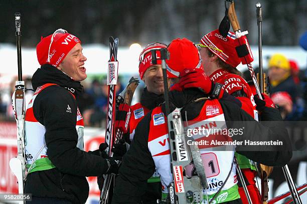 Emil Hegle Svendsen of Norway celebrates winning the 2nd place with his team mates Halvard Hanevold , Ole Einar Bjoerndalen and Tarjei Boe after the...