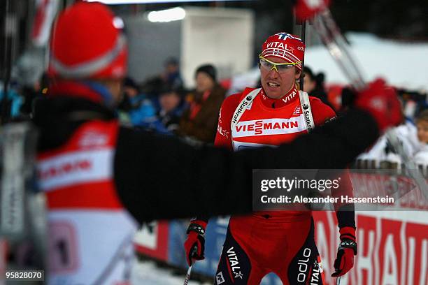 Emil Hegle Svendsen of Norway celebrates winning the 2nd place with his team mate Halvard Hanevold after the Men's 4 x 7,5km Relay in the e.on...