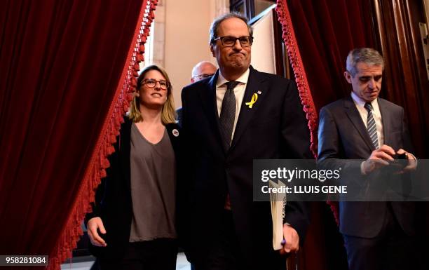 Junts per Catalonia MP and presidential candidate Quim Torra and Junts per Catalonia MP Elsa Artadi arrive to attend a vote session to elect a new...