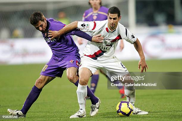 Adrian Mutu of ACF Fiorentina in action against Miguel Angel Britos of Bologna FC during the Serie A match between Fiorentina and Bologna at Stadio...