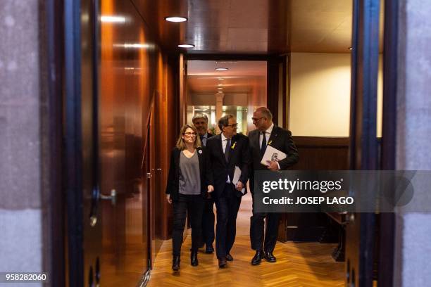 Junts per Catalonia MP and presidential candidate Quim Torra and Junts per Catalonia MPs Elsa Artadi and Eduard Pujol arrive to attend a vote session...