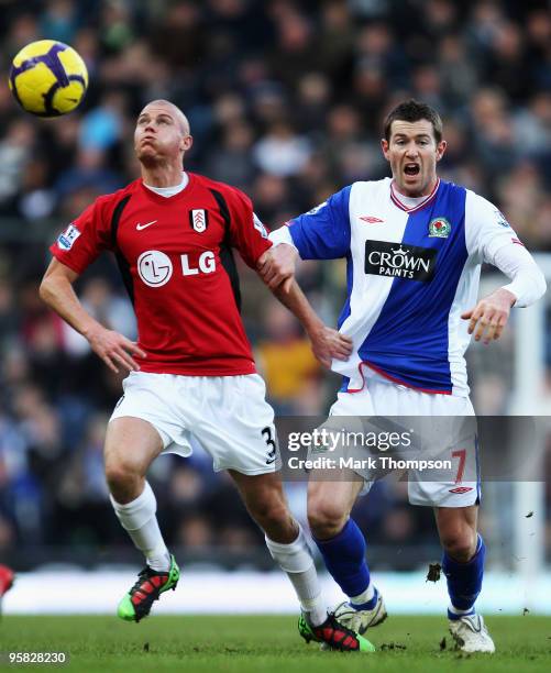 Brett Emerton of Blackburn tangles with Paul Konchesky of Fulham during the Barclays Premier League match between Blackburn Rovers and Fulham at...