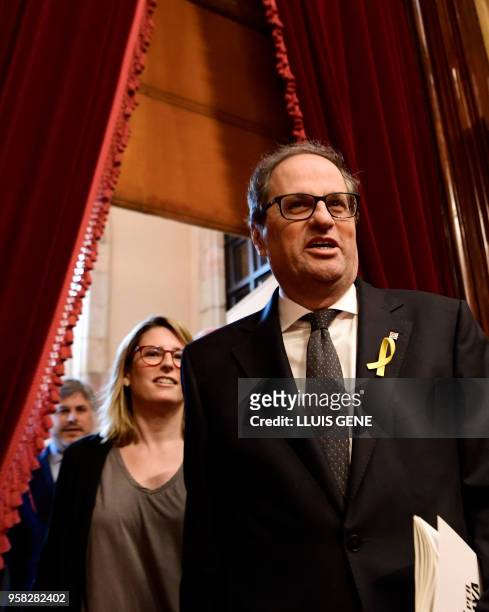 Junts per Catalonia MP and presidential candidate Quim Torra and Junts per Catalonia MP Elsa Artadi arrive to attend a vote session to elect a new...