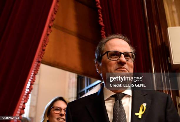 Junts per Catalonia MP and presidential candidate Quim Torra and Junts per Catalonia MP Elsa Artadi arrive to attend a vote session to elect a new...