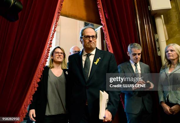 Junts per Catalonia MP and presidential candidate Quim Torra and Junts per Catalonia MP Elsa Artadi arrive to attend a vote session to elect a new...