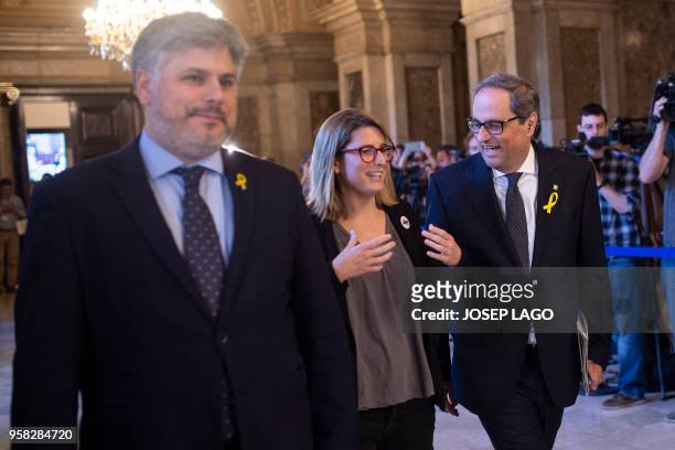 Junts per Catalonia MP and presidential candidate Quim Torra and Junts per Catalonia MP Elsa Artadi arrive to attend a vote session to elect a new...