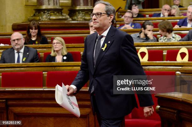 Junts per Catalonia MP and presidential candidate Quim Torra walks to delivers a speech during a vote session to elect a new regional president at...