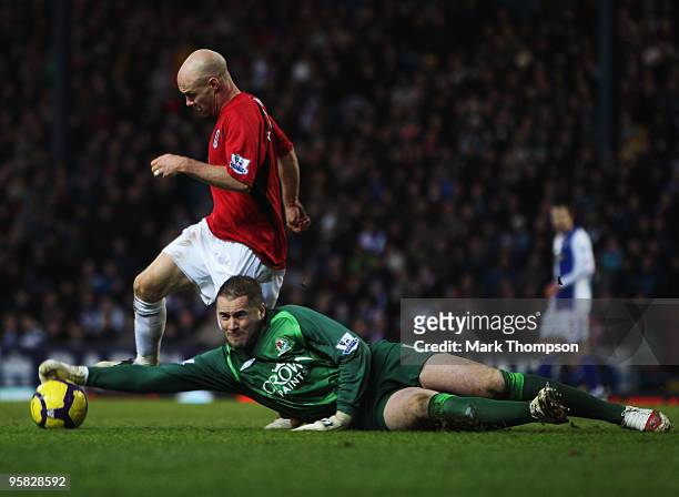 Blackburn goalkeeper Paul Robinson tangles with Andrew Johnson of Fulham during the Barclays Premier League match between Blackburn Rovers and Fulham...