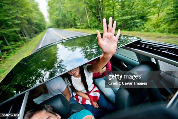 high angle view of friends travelling in car - teto de abrir de carro imagens e fotografias de stock