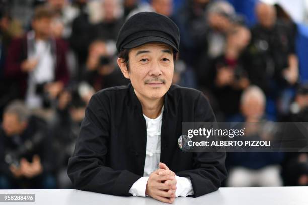 Japanese writer and actor Lily Franky poses on May 14, 2018 during a photocall for the film "Shoplifters " at the 71st edition of the Cannes Film...