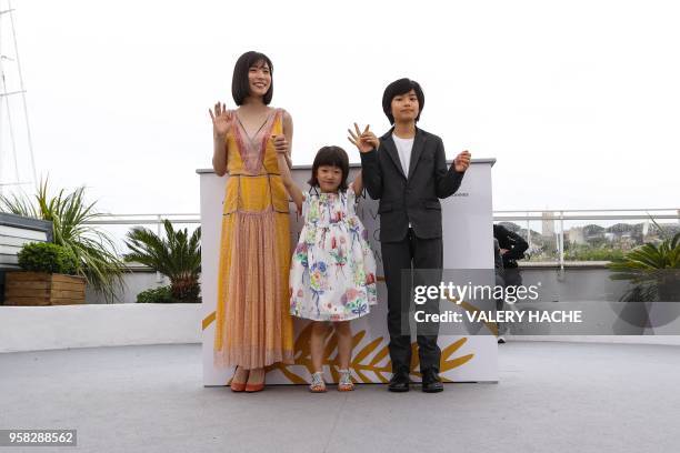 Japanese actress Matsuoka Mayu, Japanese actress Miyu Sasaki and Japanese actress Jyo Kairi pose on May 14, 2018 during a photocall for the film...