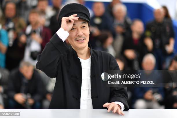 Japanese writer and actor Lily Franky poses on May 14, 2018 during a photocall for the film "Shoplifters " at the 71st edition of the Cannes Film...