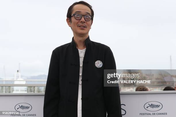 Japanese writer and actor Lily Franky poses on May 14, 2018 during a photocall for the film "Shoplifters " at the 71st edition of the Cannes Film...