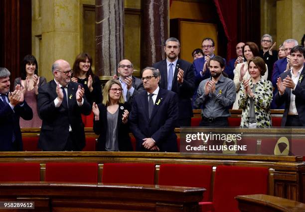 Junts per Catalonia MP and presidential candidate Quim Torra is applauded by his parliamentary group following his speech during a vote session to...