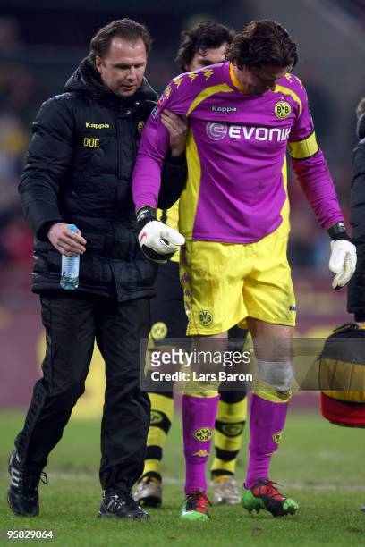 Goalkeeper Roman Weidenfeller of Dortmund leaves injured the pitch during the Bundesliga match between 1. FC Koeln and Borussia Dortmund at...
