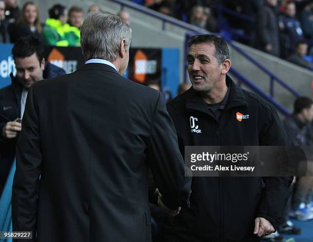 Bolton Wanderers Manager Owen Coyle greets Arsenal Manager Arsene Wenger prior to the Barclays Premier League match between Bolton Wanderers and...