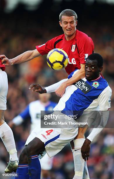 Chris Samba of Blackburn tangles with Brede Hangeland of Fulham during the Barclays Premier League match between Blackburn Rovers and Fulham at Ewood...