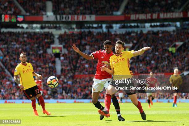 Craig Cathcart of Watford tackles Marcus Rashford of Man Utd during the Premier League match between Manchester United and Watford at Old Trafford on...