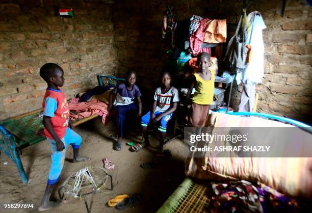 Displaced children stand at a camp for Internally Displaced Persons near Kadugli, the capital of Sudan's South Kordofan state during a United Nations...