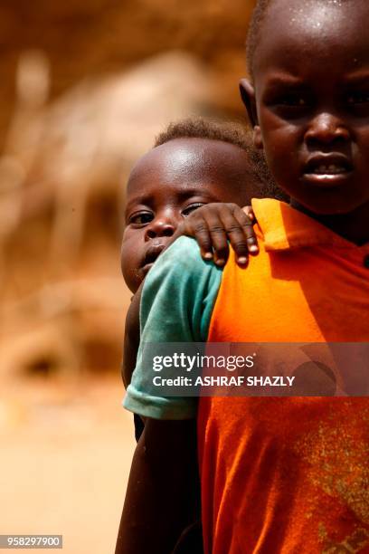 Displaced children are seen at a camp for Internally Displaced Persons near Kadugli, the capital of Sudan's South Kordofan state during a United...