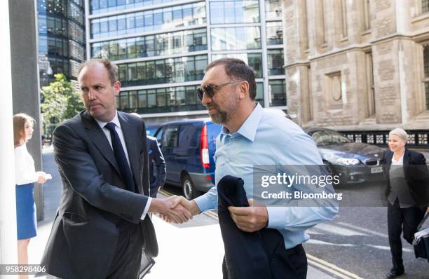 Oleg Deripaska, billionaire and president of United Co. Rusal Plc, right, arrives to attend the court hearing on MMC Norilsk Nickel PJSC at The Rolls...