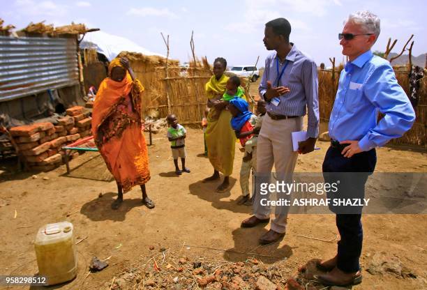 Under-Secretary General for Humanitarian Affairs and Emergency Relief Coordinator Mark Lowcock talks with displaced Sudanese people as he visits a...