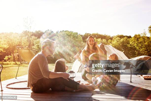 happy family sitting on porch - family five people stock pictures, royalty-free photos & images