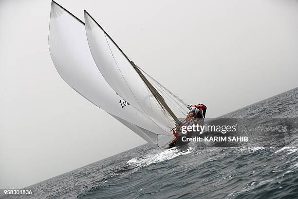 Team sails a traditional wooden boat, or a dhow, called Ghazi owned by Sheikh Hamdan bin Mohammed bin Rashid during the al-Gaffal traditional...