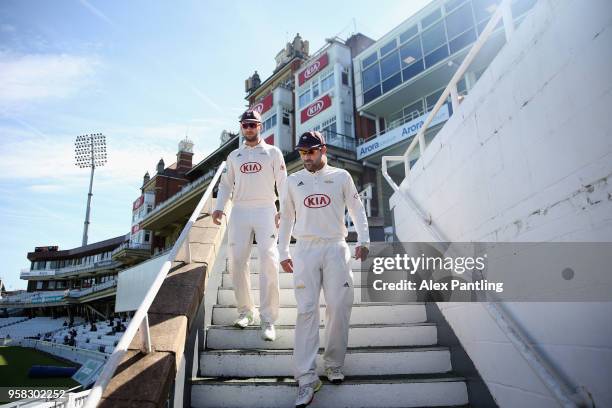 Dean Elgar of Surrey makes his way out onto the field to begin day four of the Specsavers County Championship Division One match between Surrey and...