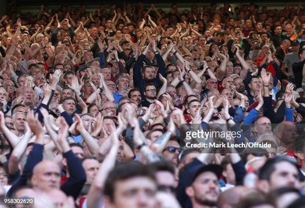 Liverpool supporters applauding on the Spion Kop during the Premier League match between Liverpool and Brighton and Hove Albion at Anfield on May 13,...