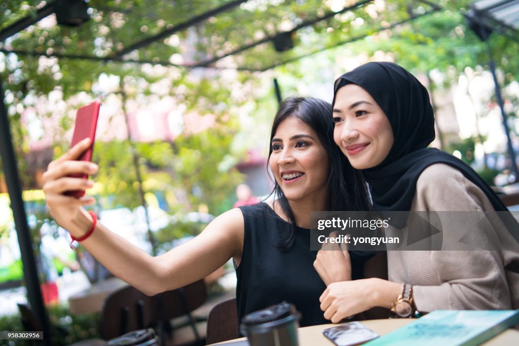 Two Malaysian girls taking a selfie