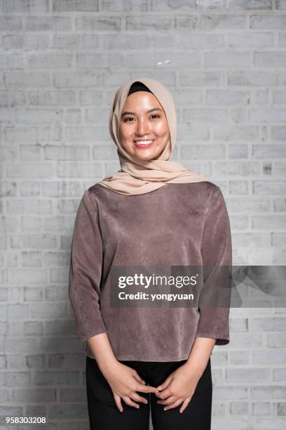 cheerful muslim girl - yongyuan stock pictures, royalty-free photos & images