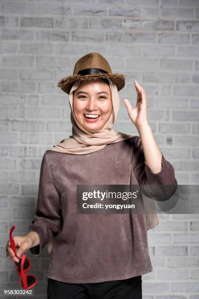 cheerful muslim girl - yongyuan stock pictures, royalty-free photos & images