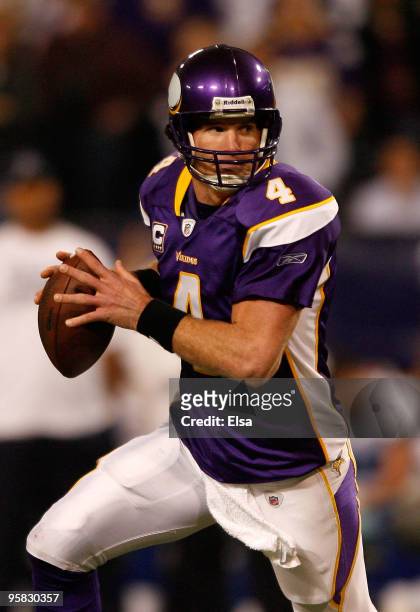 Quarterback Brett Favre 4# of the Minnesota Vikings looks to throw a pass in the second quarter against the Dallas Cowboys during the NFC Divisional...