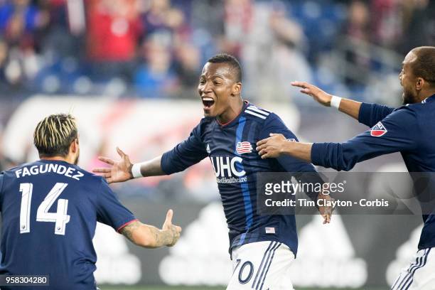 May 12: Cristian Penilla of New England Revolution is congratulated by team mates Diego Fagundez of New England Revolution and Teal Bunbury of New...
