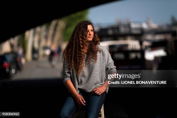 In this photograph taken on May 4 French round the world sailor Marie Tabarly poses during a photo session on the banks of the River Seine in Paris.