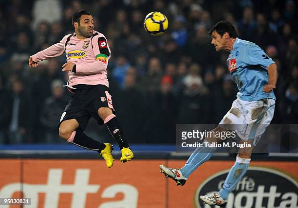 Fabrizio Miccoli of Palermo and Christian Maggio of Napoli compete for a header during the Serie A match between SSC Napoli and US Citta di Palermo...