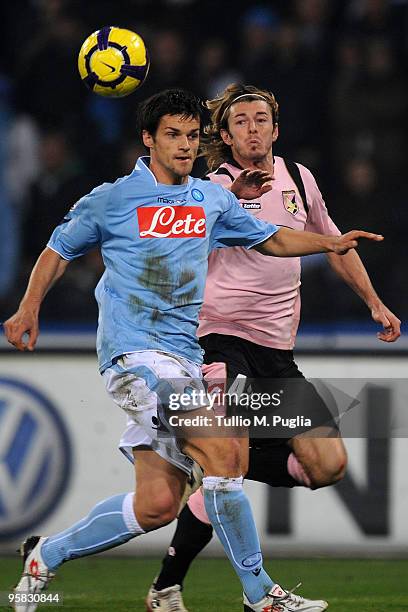 Christian Maggio of Napoli and Federico Balzaretti of Palermo compete for the ball during the Serie A match between SSC Napoli and US Citta di...