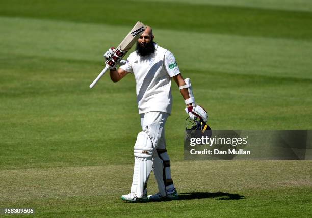 Hashim Amla of Hampshire celebrates reaching his century during day four of the Specsavers County Championship Division One between Somerset and...