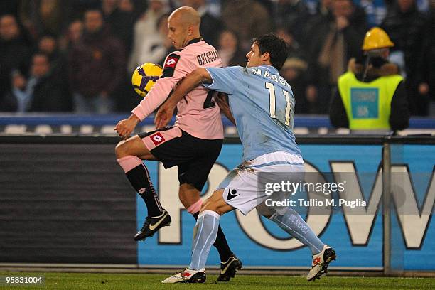 Mark Bresciano of Palermo and Christian Maggio of Napoli compete for the ball during the Serie A match between SSC Napoli and US Citta di Palermo at...