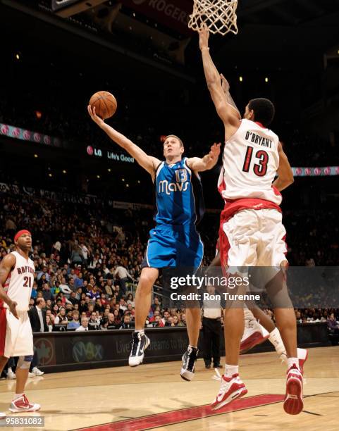 Matt Carroll of the Dallas Mavericks tries the layup contested by Patrick O'Bryant of the Toronto Raptors during a game on January 17, 2010 at the...