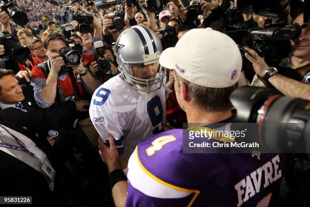 Quarterback Tony Romo of the Dallas Cowboys congratulates quarterback Brett Favre of the Minnesota Vikings on their 34-3 victory during the NFC...