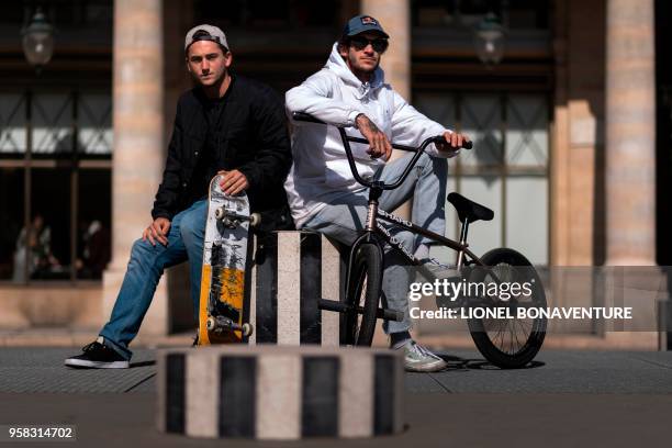 In this photograph taken on May 3 French skateboarder Joseph Garbaccio poses with French BMX rider Matthias Dandois during a photo session at The...