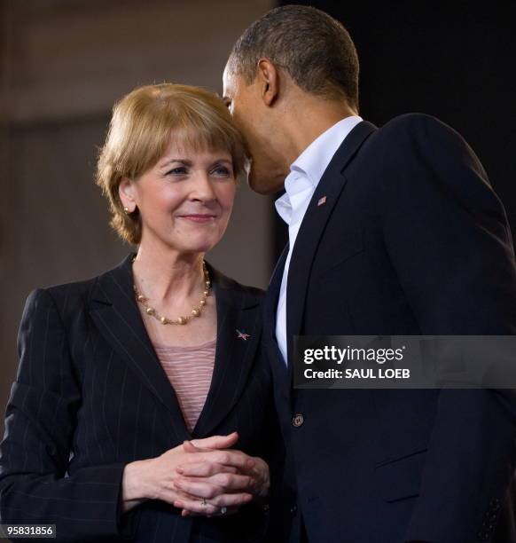 President Barack Obama talks with US Senate candidate Democrat Martha Coakley during a campaign rally for Coakley at the Cabot Center at Northeastern...