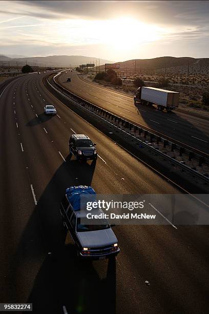 Trucks and cars travel the Interstate 10 freeway on January 17, 2010 near of Palm Springs, California. The San Andreas earthquake fault crosses all...