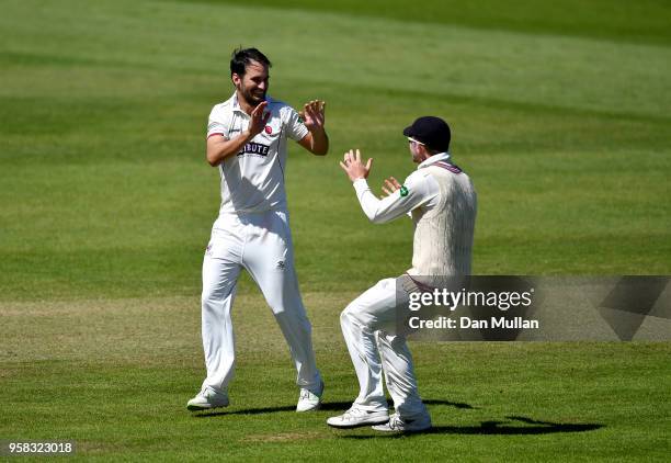 Lewis Gregory of Somerset celebrates with Tom Abell of Somerset after taking the wicket of Hashim Amla of Hampshire during day four of the Specsavers...