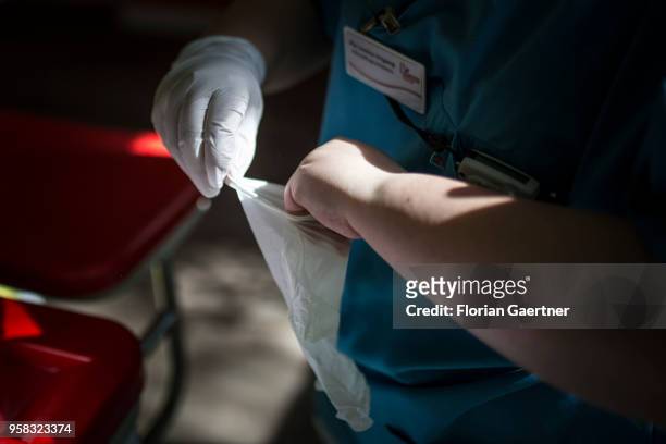 Nurse puts on gloves on April 27, 2018 in Berlin, Germany.