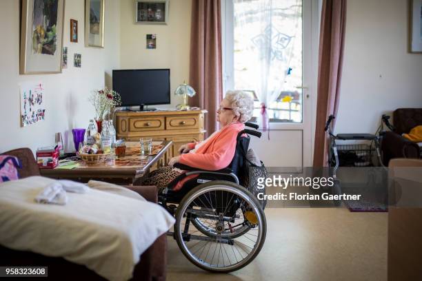 An elderly woman in a wheelchair sits alone in her room in a nursing home on April 27, 2018 in Berlin, Germany.