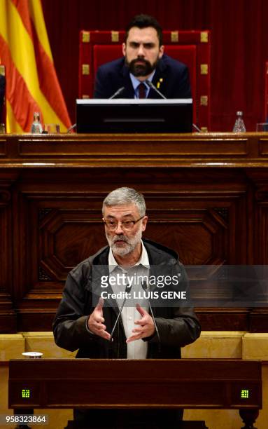 Catalan pro-independence anticapitalist party "Candidatura d'Unitat Popular - CUP" MP Carles Riera speaks during a vote session to elect a new...