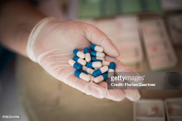 Pills on the hand of a geriatric nurse on April 27, 2018 in Berlin, Germany.